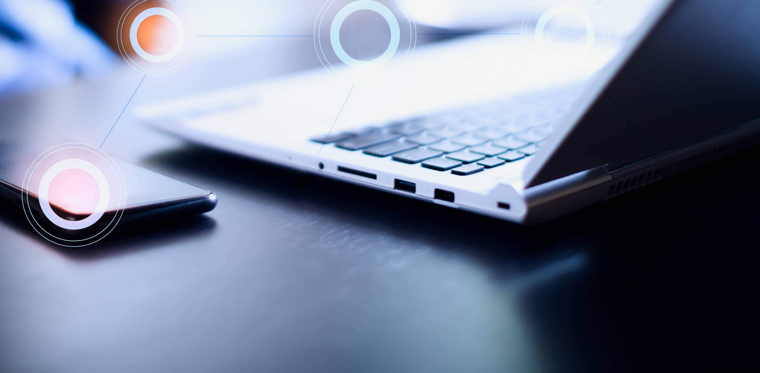 Laptop and phone on desk